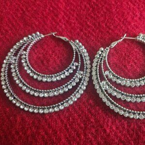 Large silver hoop earrings with diamond stones